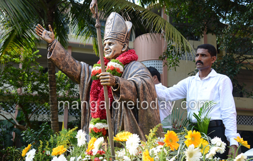 vehicle rally carrying the  statue of Pope John Paul II